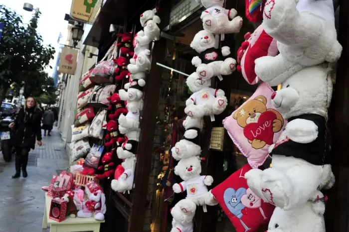 Framed Print : A woman walks past a shop selling love themed toys ahead of Valentine s Framed Print : A woman walks past a shop selling love themed toys ahead of Valentine s