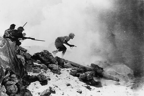 A British officer armed with a revolver leading his men forward with fixed bayonets