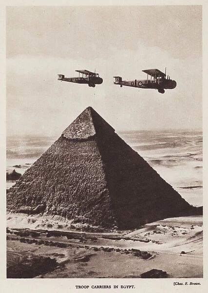 British troop carrier aircraft of the RAF flying over the Pyramids, Giza, Egypt (b  /  w photo)