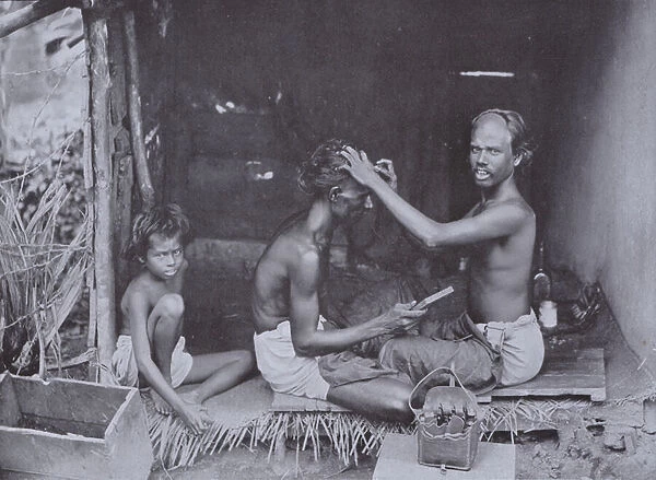 A Ceylon Shave, the Hindoo caste have the head shaved in curious shapes, such as that seen on the barber (b  /  w photo)