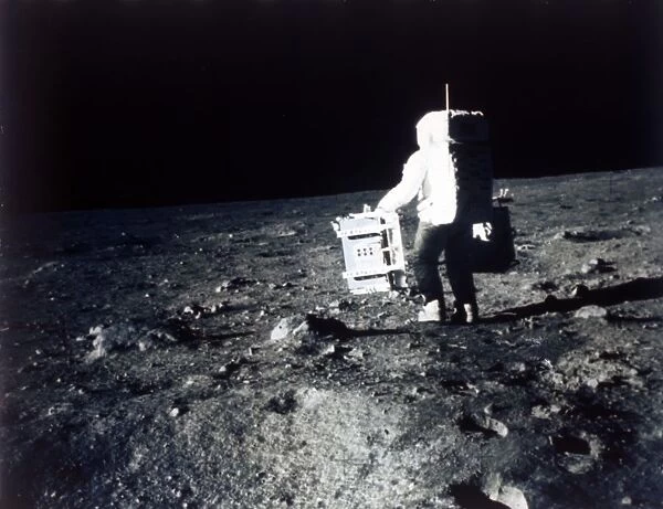 Buzz Aldrin carries out an experiment on the lunar surface, Apollo II mission, July 1969
