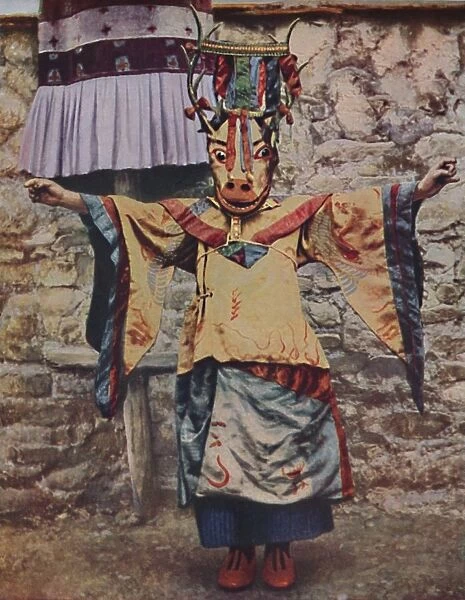 Tibetan lama attired for the devil dance, c1935