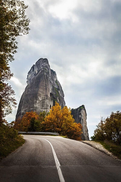 Rugged Cliffs, Road And Autumn Foliage; Meteora, Greece