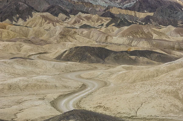 Dirt road winding through rock formations, Twenty Mule Team Canyon, Death Valley National Park