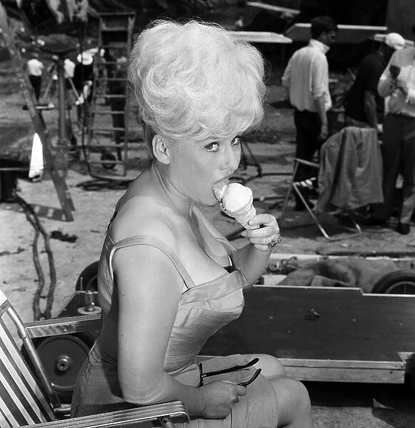 Barbara Windsor, a tiny five feet nothing, is described as a cute