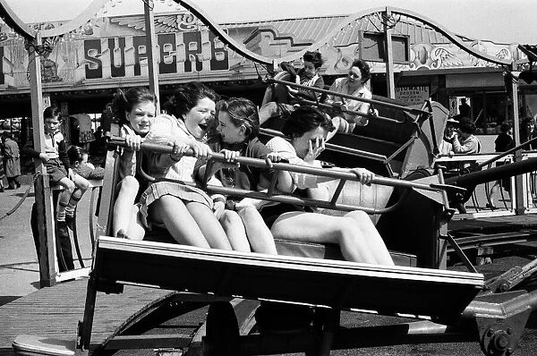 A group of girls at the fairground at Barry Island, Vale of Glamorgan, Wales