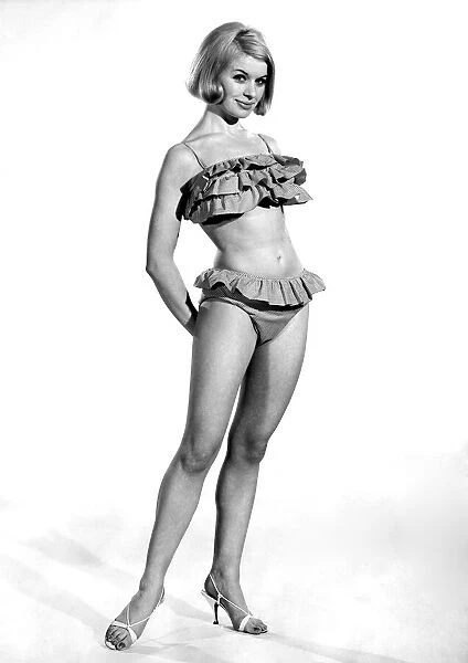 Model Vyoyan Dunbar wearing a frilly bikini outfit. July 1965 P009023