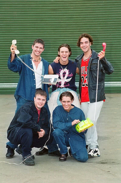 Photo shows boy band Take That, Howard Donald (top left), Jason Orange (top middle)