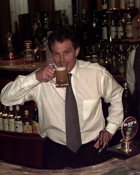 Tony Blair Labour Party leader in a pub drinking a half pint of beer named after him