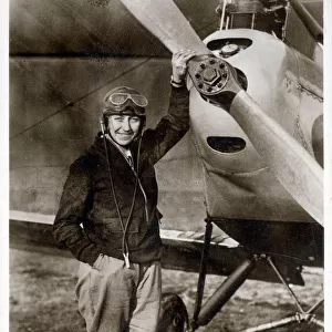 Amy Johnson CBE (1903-1941) - pioneering English female pilot - pictured standing in