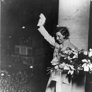 Amy Johnson greets the crowds from Grosvenor House