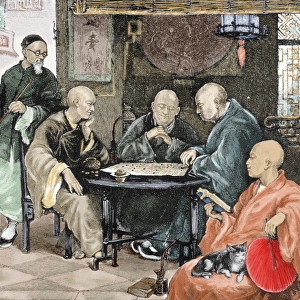 China. Men playing draughts in a tavern