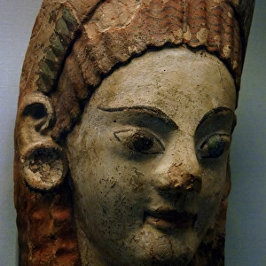 Etruscan painted antefix with shaped head of woman. 520-500
