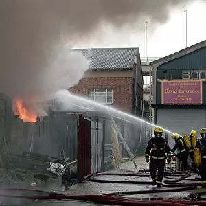 Firefighters at scene of commercial premises fire