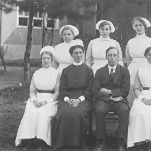 Formal group photograph, six nurses, senior nurse, gentlema