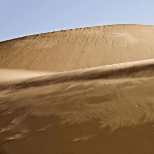 Sand blowing along the slipface of a dune - Dune Fields - Namib Desert - Namibia - Africa