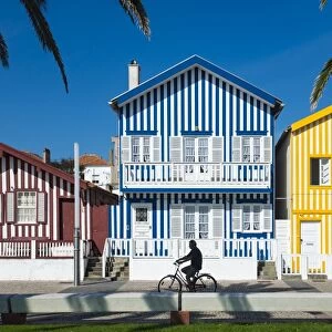 Colourful stripes decorate traditional beach house style on houses in Costa Nova