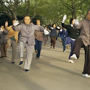 Crowd of people practicing Tai Chi, Shanghai, China, Asia