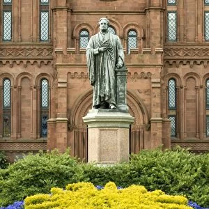 Entrance to the Smithsonian Castle with statue of Joseph Henry outside on the Mall in Washington, D. C. United States of America, North America