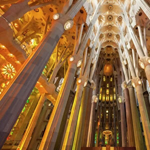La Sagrada Familia church, basilica interior with stained glass windows by Antoni Gaudi