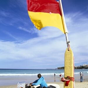 Swimming flag and patrolling lifeguard at Bondi Beach, Sydney, New South Wales
