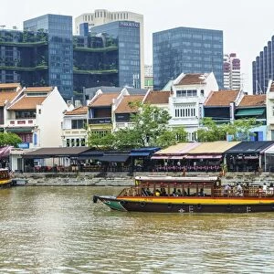 Tour boat passing Boat Quay, Singapore, Southeast Asia, Asia