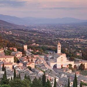 View over Assisi to Santa Chiara Basilica and San Rufino Cathedral at sunset, Assisi