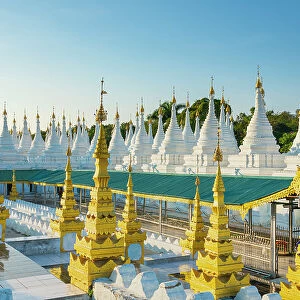 White pagodas at Sanda Muni pagoda, Mandalay, Myanmar (Burma), Asia