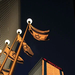 Israel, Tel Aviv, an illuminated Israeli flag at Azrieli Center on Independence day