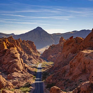 Straight road between red rocks during sunny day, Valley of Fire State Park, Nevada