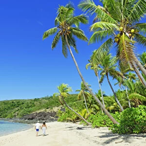 Walking on a tropical beach, Drawaqa Island, Yasawa island group, Fiji, South Pacific