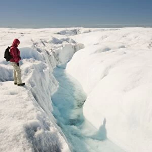 Melt water on the Greenland ice sheet near camp Victor north of Ilulissat. The Greenland ice sheet is the largest ice sheet outside of Antarctica. Temperatures have risen by nine degrees Fahrenheit in Greenland in the last 60 years due to human