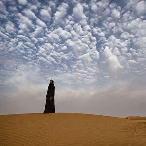 Bedouin woman in the desert. Abu Dhabi, UAE