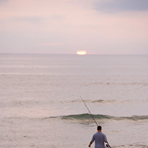 Early morning surfcasting on the beach at Cape Cod National Seashore in Massachusetts
