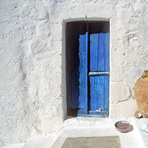 Greece, Symi. Blue door and pot. Credit as: Jim Nilsen / Jaynes Gallery / DanitaDelimont