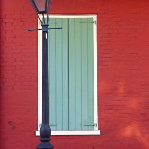 USA, Louisiana, New Orleans. Lamp post and window