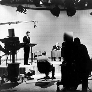KENNEDY / NIXON DEBATE, 1960. John F. Kennedy, 35th President of the United States, debating Richard M. Nixon on television during the 1960 Presidential Campaign, moderated by Howard K. Smith