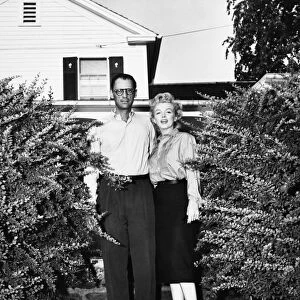 MILLER & MONROE, 1956. American playwright Arthur Miller and movie star Marilyn Monroe, photographed in front of Millers summer house at Roxbury, Connecticut, shortly before their wedding, June 1956