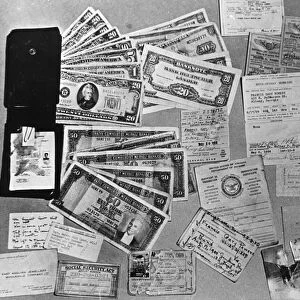 Currency, documents, and personal photographs found on u2 spy plane pilot francis gary powers after he was shot down over soviet territory on may 1, 1960, ussr
