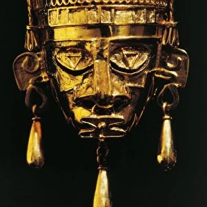 Gold mask of God Xipe Totec (Our Lord the Flayed One) from tomb no 7 at the Monte Alban archaeological site, Mexico