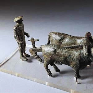Italy, Arezzo Province, Bronze statuette of ploughman with oxen