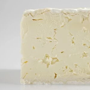 Slice of French Brillat-Savarin cows milk cheese