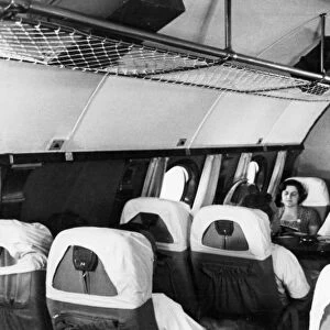 A stewardess and passengers aboard a tu-114 airliner (at the time, the worlds largest), 1959