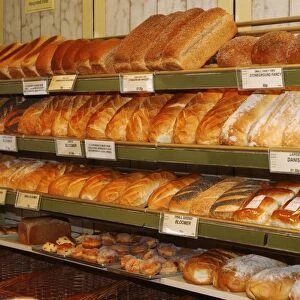 Variety of bread on display in a bakery