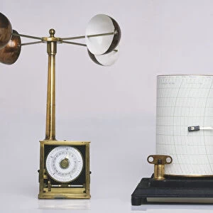 Weather station equipment including wind instruments and, at centre, a barograph