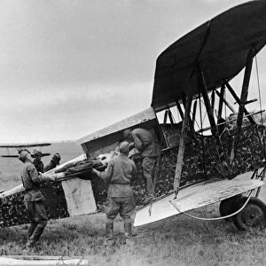 A wounded red army soldier being loaded into a polikarpov po-2 (u-2) plane during world war 2