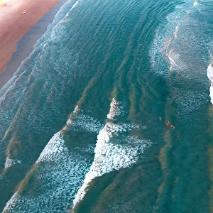 crystal clear waters with swimmers as seen from above