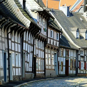 Half timbered houses and cobbled street in the historic old town of Goslar, Germany