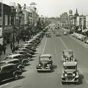 Retro style cars riding on street, (B&W), (Elevated view)