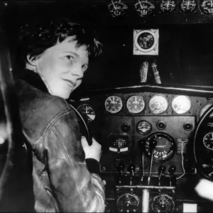 Amelia Earhart at the controls of her plane